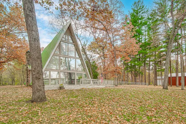 a view of outdoor space with swimming pool and tree s