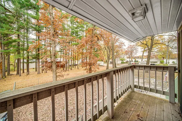 a view of balcony with wooden floor