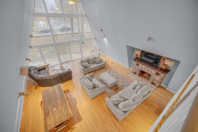 a view of a livingroom with furniture and chandelier fan
