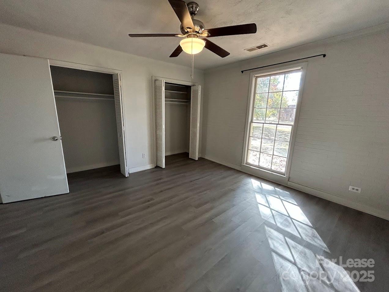 3312 Circles End Circle Charlotte, NC 28226 - Photo 14 of 22 a view of an empty room with wooden floor and a window