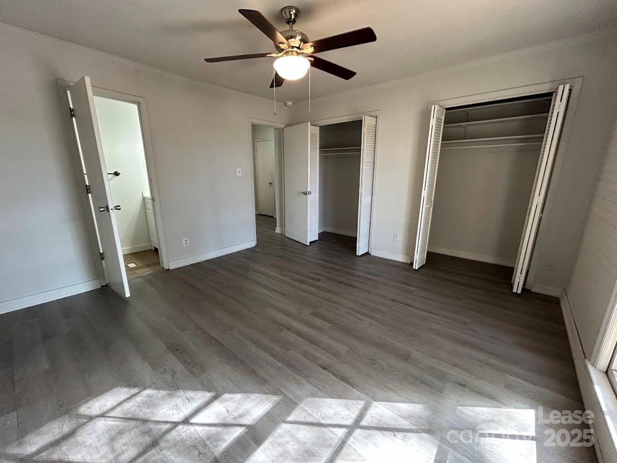 3312 Circles End Circle Charlotte, NC 28226 - Photo 15 of 22 a view of empty room with wooden floor and fan