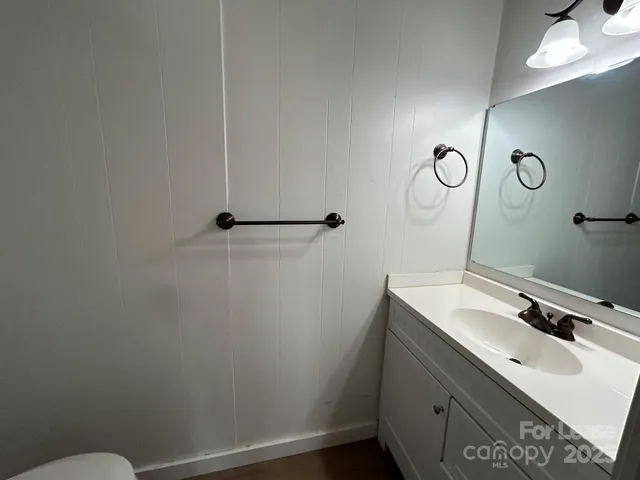 a bathroom with a sink and mirror