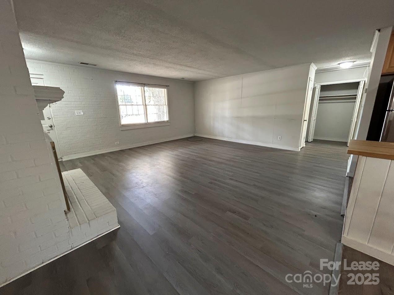 3312 Circles End Circle Charlotte, NC 28226 - Photo 6 of 22 an empty room with wooden floor and windows