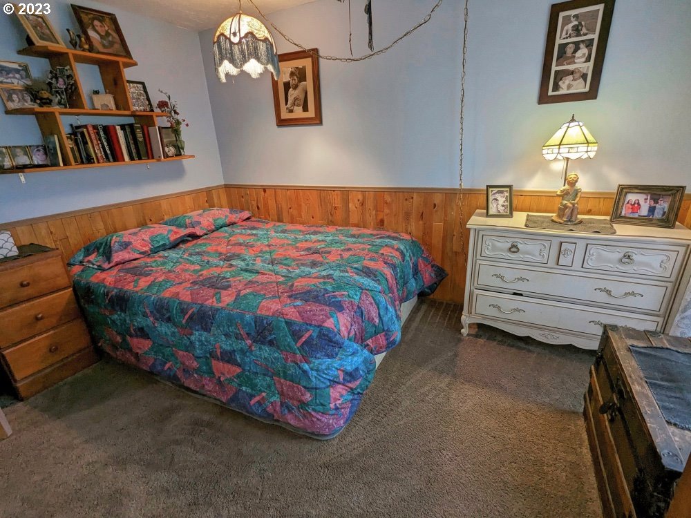 72769 Snowdon Road Rhododendron, OR 97049 - Photo 19 of 48 a bedroom with a bed and dresser