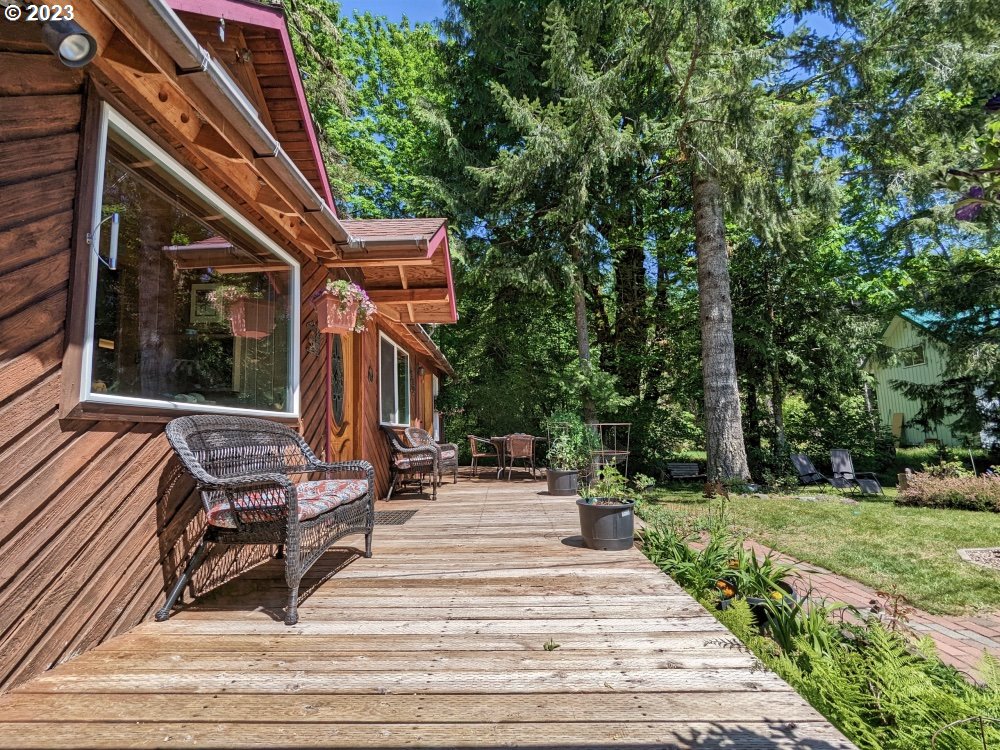 72769 Snowdon Road Rhododendron, OR 97049 - Photo 44 of 48 a view of a patio with chairs and a yard
