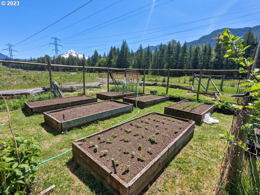 72769 Snowdon Road Rhododendron, OR 97049 - Photo 46 of 48 a view of a wooden deck with chairs and a yard
