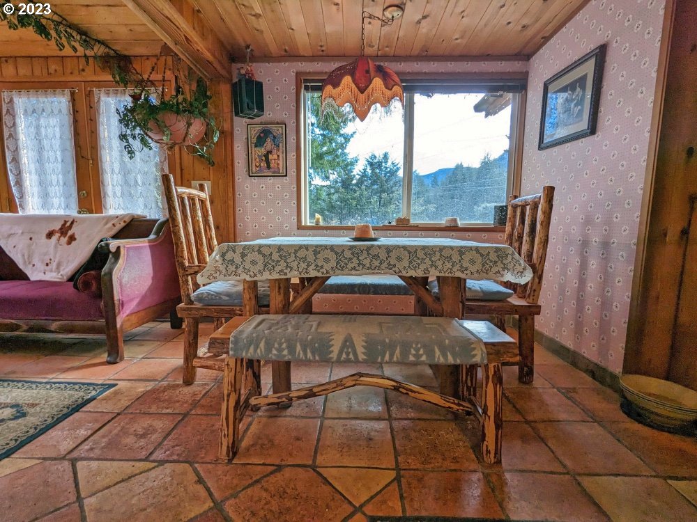 72769 Snowdon Road Rhododendron, OR 97049 - Photo 8 of 48 a view of a dining room with furniture window and outside view