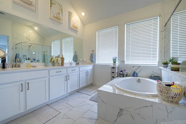 a bathroom with a bathtub and a sink