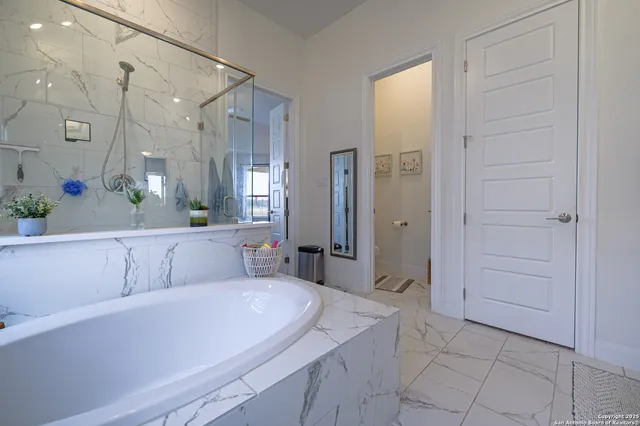 a bathroom with a sink a mirror and a bathtub