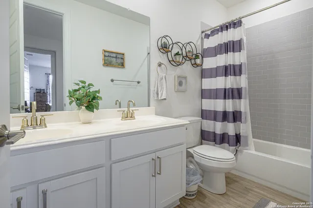 a bathroom with a bathtub and shower
