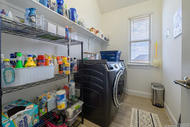 a aerial view of a house with swimming pool and a yard