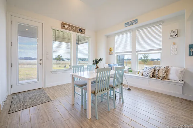a spacious bedroom with a bed and a chandelier