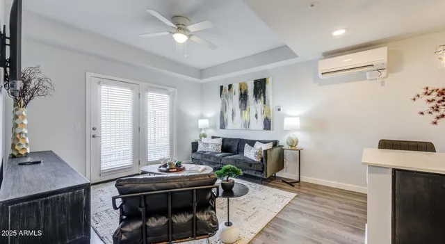 a living room with furniture and a fireplace
