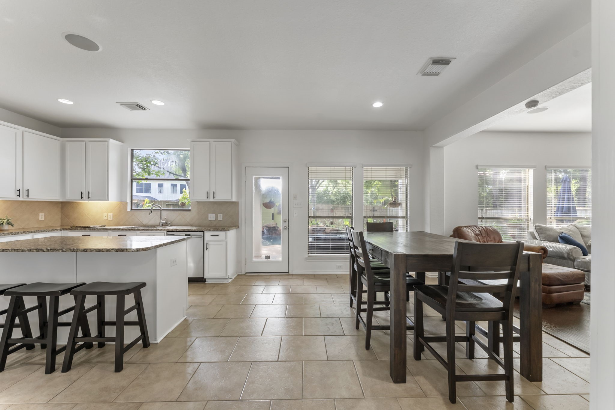 2106 Leaf Meadows Court Spring, TX 77386 - Photo 10 of 34 a large kitchen with a table and chairs