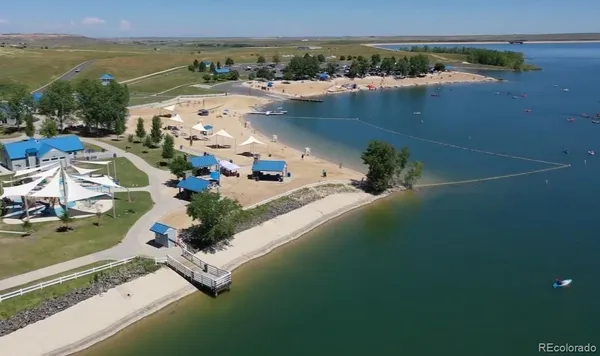 an aerial view of a house with a lake view