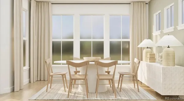a dining room with furniture and window