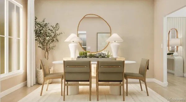 a dining room with furniture and a mirror