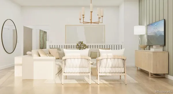 a living room with furniture a flat screen tv and white walls