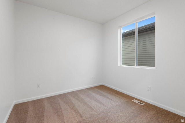 1302 East 1670th North, Unit 908 Payson, UT 84651 - Photo 12 of 21 Carpeted spare room featuring baseboards