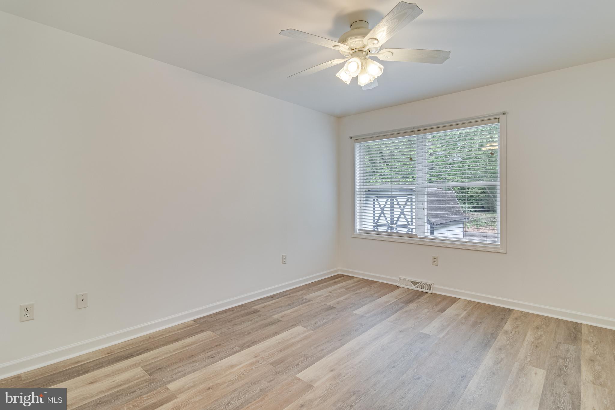 12015 Woodbury Road Nanjemoy, MD 20662 - Photo 34 of 53 an empty room with a window and a fan