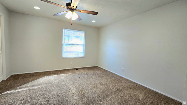 8732 Fairoaks Circle Sandy, UT 84070 - Photo 18 of 18 Unfurnished room with ceiling fan, carpet flooring, and recessed lighting
