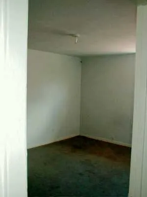 an empty room with a bench