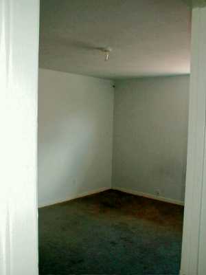 4601 Gollihar Road, Unit 1 Corpus Christi, TX 78411 - Photo 5 of 7 an empty room with a bench