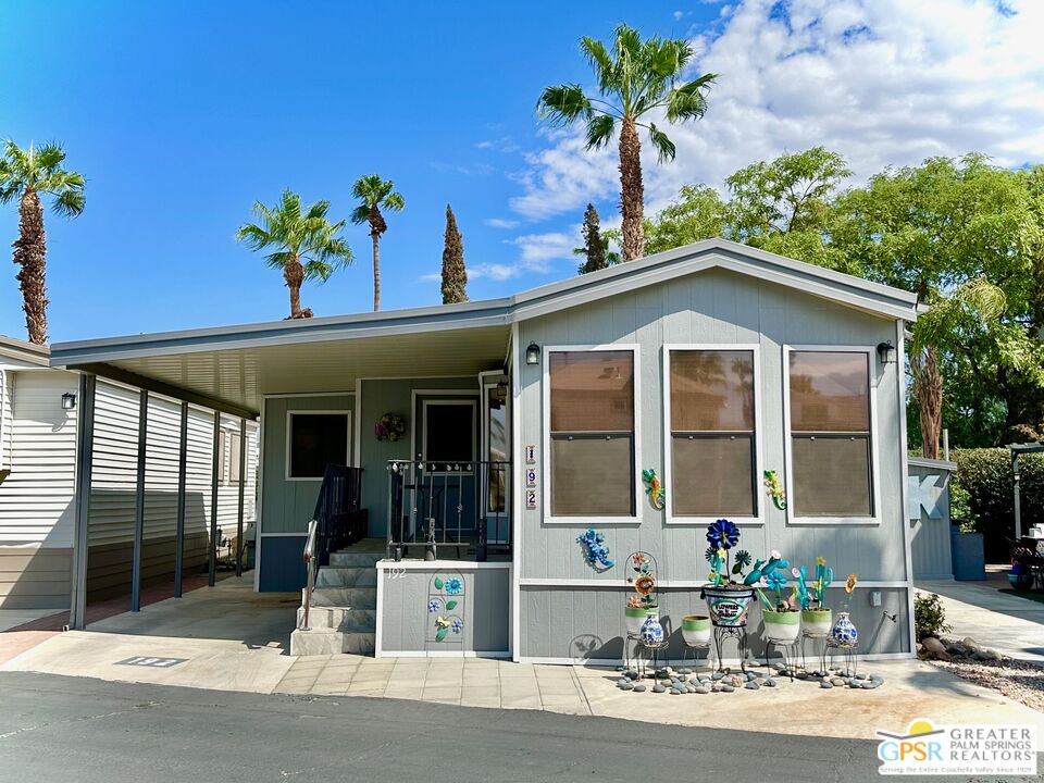 69801 Ramon Road, Unit 192 Cathedral City, CA 92234 - Photo 1 of 18 a front view of a house with a porch