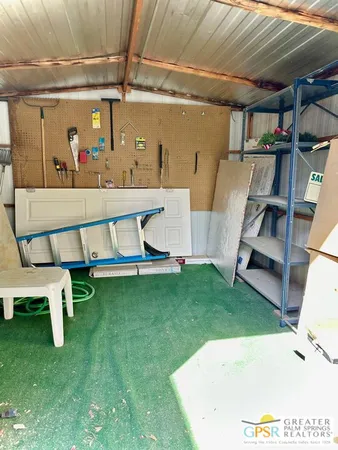 a view of swimming pool with a table and chairs