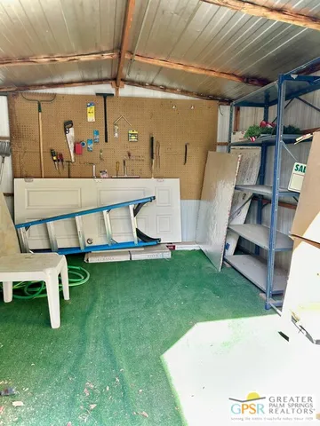 a view of swimming pool with a table and chairs