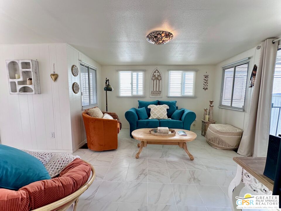 69801 Ramon Road, Unit 192 Cathedral City, CA 92234 - Photo 4 of 18 a living room with furniture and a large window
