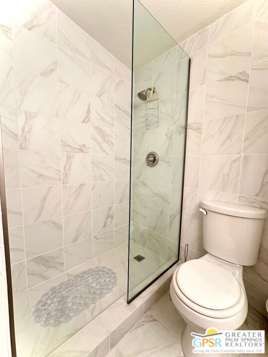 69801 Ramon Road, Unit 192 Cathedral City, CA 92234 - Photo 9 of 18 a bathroom with a toilet and a shower