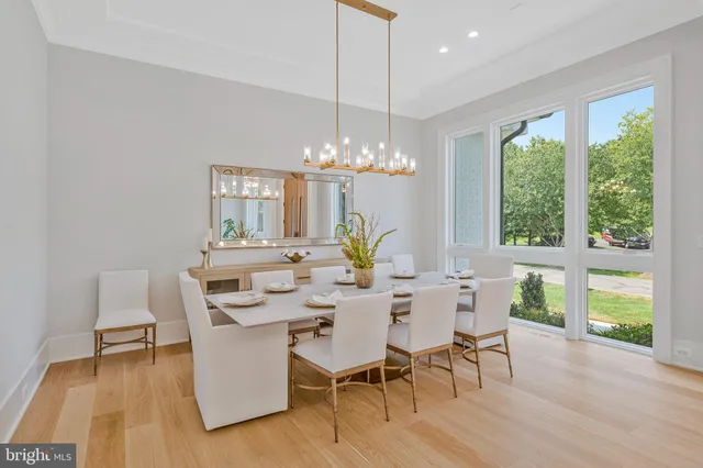 a living room with furniture and large windows