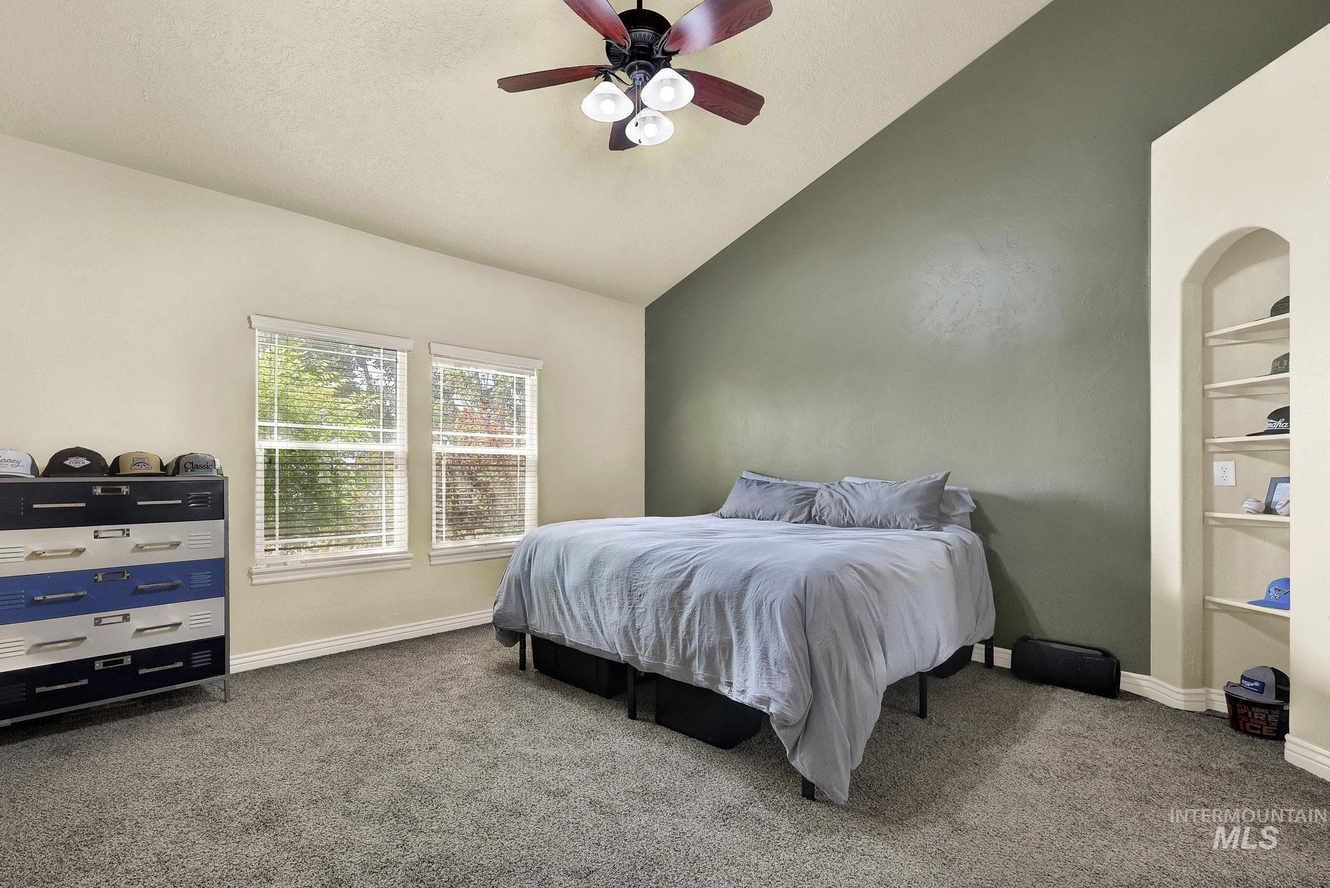 27114 Lower Pleasant Ridge Road Wilder, ID 83676 - Photo 35 of 48 Carpeted bedroom with vaulted ceiling and a ceiling fan