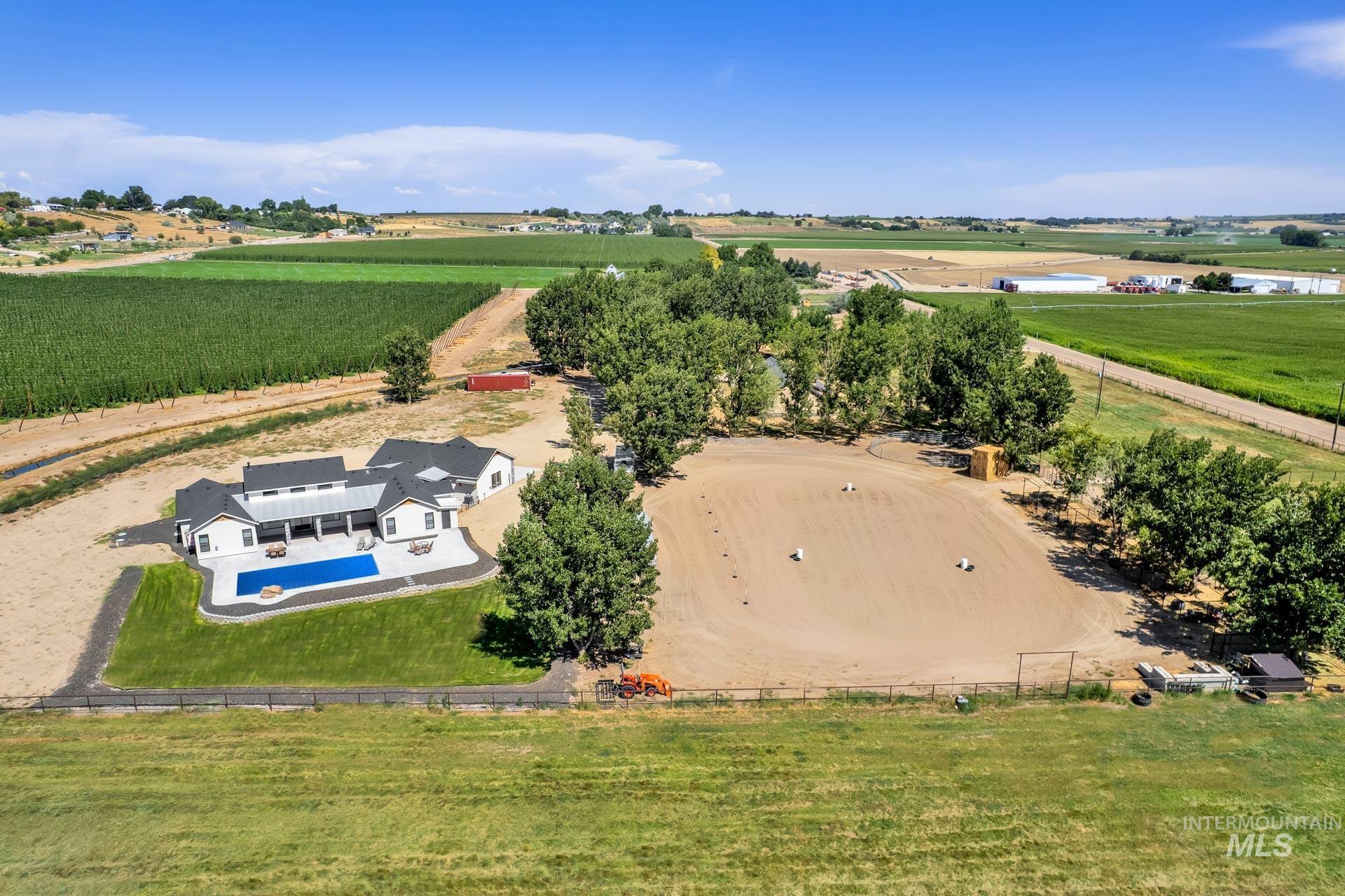 27114 Lower Pleasant Ridge Road Wilder, ID 83676 - Photo 49 of 50 View of rural area featuring a pool area and rows of crops