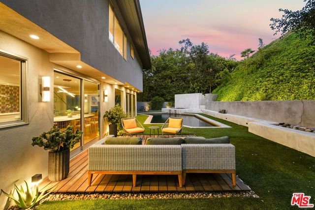a view of swimming pool with outdoor seating