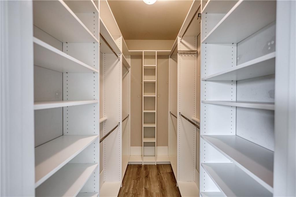 325 Tarpley Way Covington, GA 30016 - Photo 19 of 62 a view of walk in closet with empty racks