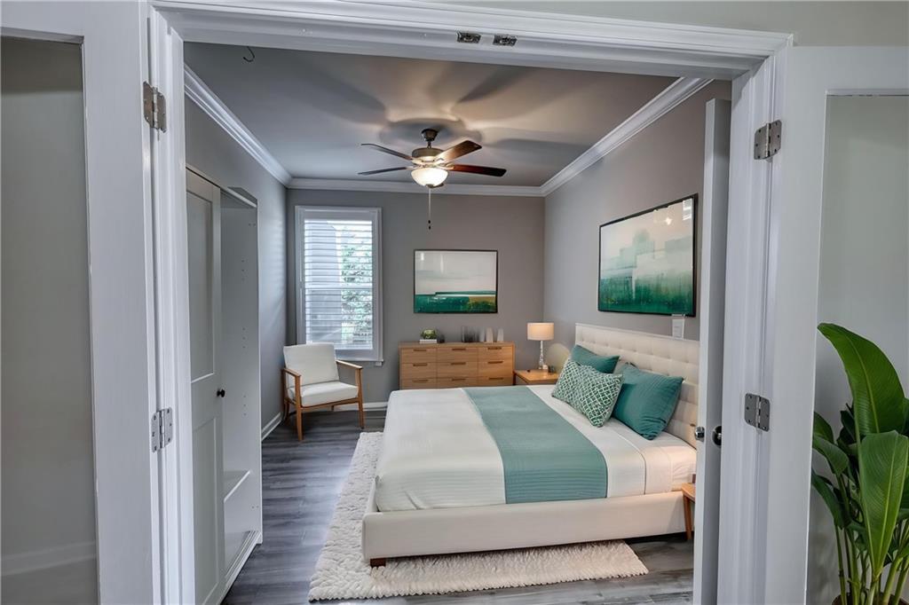 325 Tarpley Way Covington, GA 30016 - Photo 25 of 62 a living room with furniture and a flat screen tv