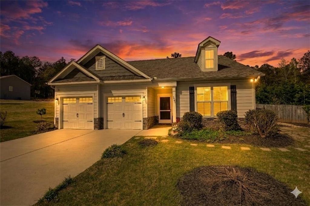 325 Tarpley Way Covington, GA 30016 - Photo 3 of 62 a front view of a house with a yard outdoor seating and covered with an outdoor space