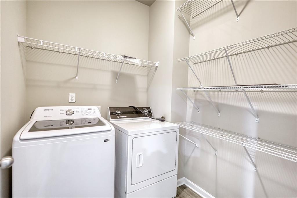 325 Tarpley Way Covington, GA 30016 - Photo 32 of 62 a utility room with dryer and washer