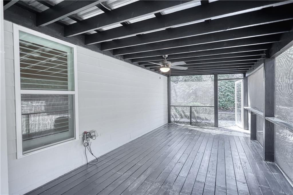 325 Tarpley Way Covington, GA 30016 - Photo 41 of 62 a view of empty room with wooden floor and fan