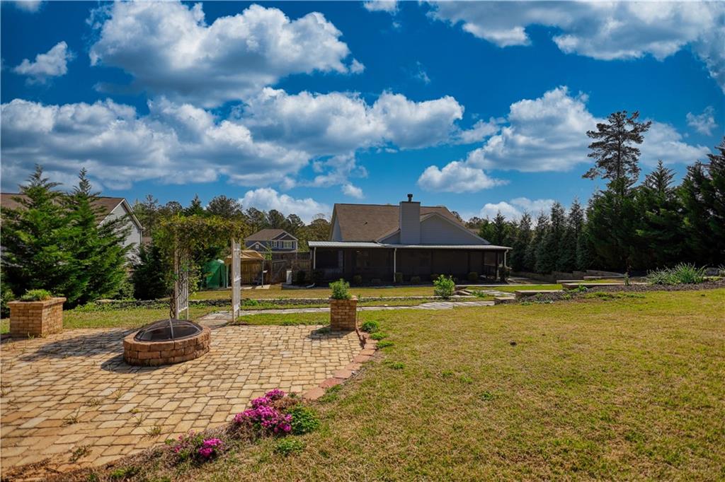 325 Tarpley Way Covington, GA 30016 - Photo 49 of 62 a view of a swimming pool with a yard
