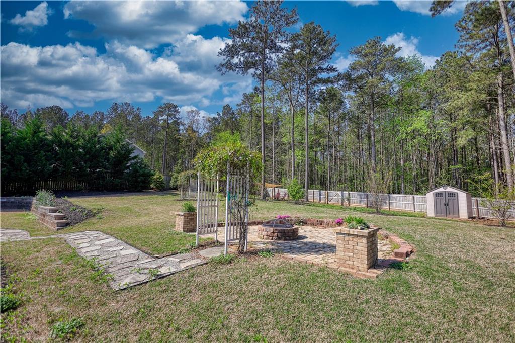 325 Tarpley Way Covington, GA 30016 - Photo 50 of 62 a garden view with a sitting space