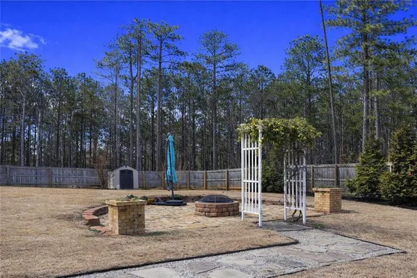 a view of a park with iron fence