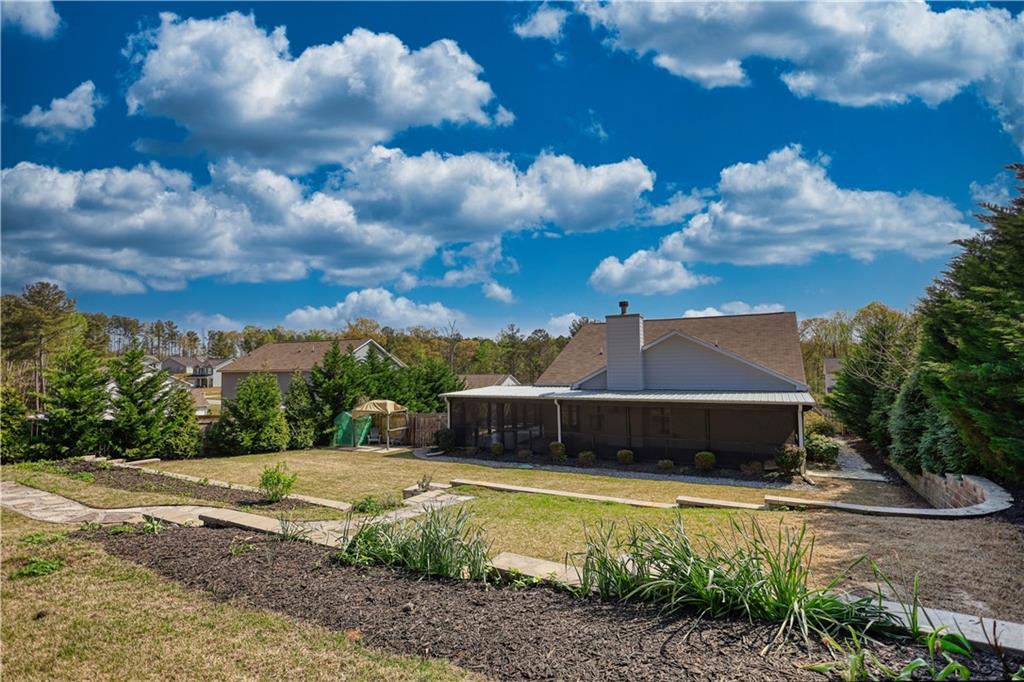 325 Tarpley Way Covington, GA 30016 - Photo 52 of 62 a view of a house with a yard