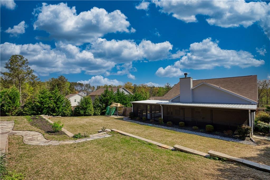 325 Tarpley Way Covington, GA 30016 - Photo 53 of 62 a view of a swimming pool with a yard