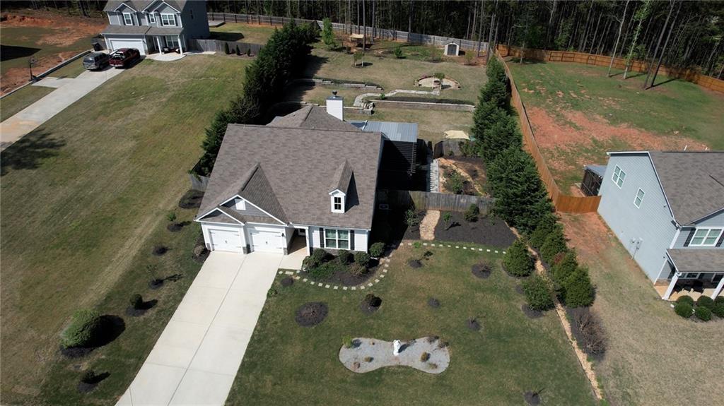 325 Tarpley Way Covington, GA 30016 - Photo 58 of 62 an aerial view of a house with a yard