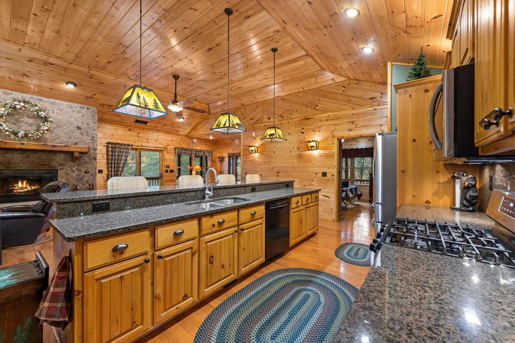 34 Smokey Ridge Lane Morganton, GA 30560 - Photo 12 of 47 a kitchen with stainless steel appliances granite countertop a sink and cabinets