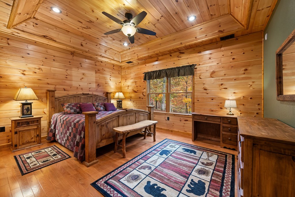 34 Smokey Ridge Lane Morganton, GA 30560 - Photo 16 of 47 a spacious bedroom with a bed and wooden floors