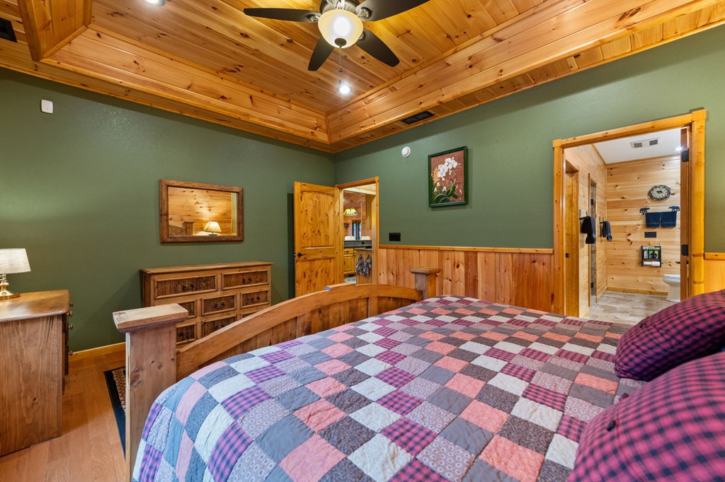 34 Smokey Ridge Lane Morganton, GA 30560 - Photo 17 of 47 a bedroom with a bed and a flat screen tv